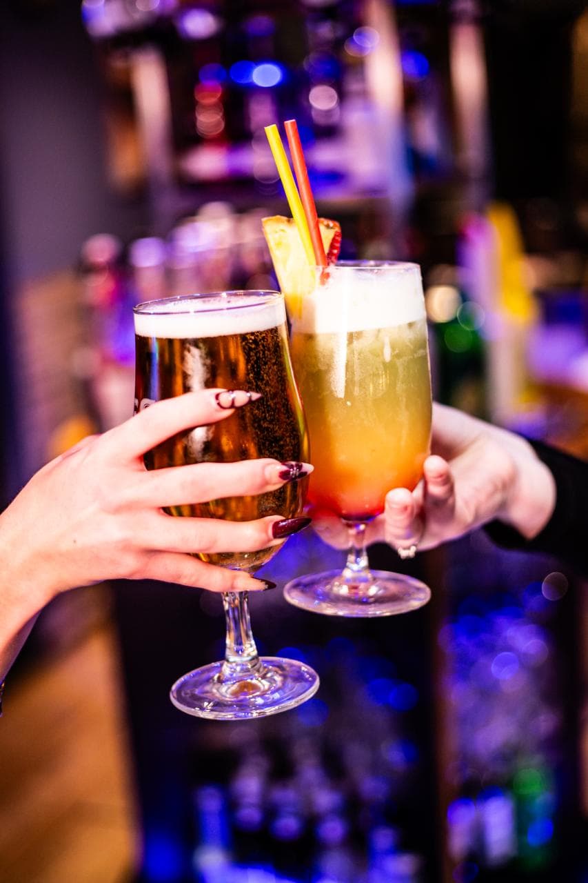 Friends toasting at the bar